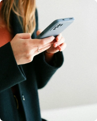 A young woman checks her email and immediately finds a newsletter from her favorite company