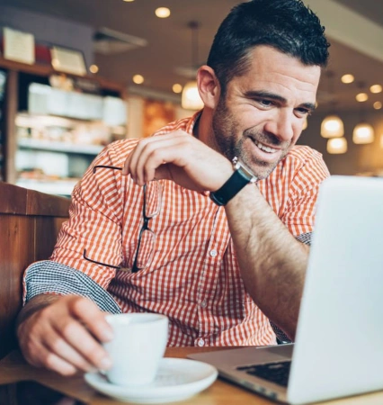 A young man uploads contacts easily, content in the knowledge that he never has to delete them or upload them again